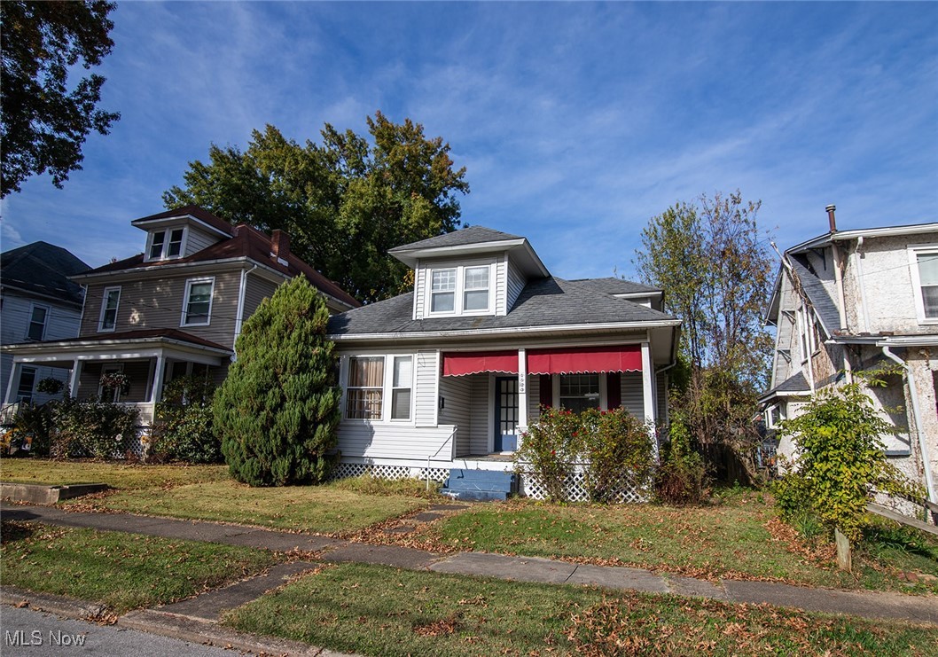 Sold-As-Is Seller won't do any repairs. Imagine creating your perfect home in this spacious, character-filled property. The inviting living room features built-in bookcases that frame a decorative fireplace, creating a cozy focal point for gatherings or quiet evenings. Elegant French doors lead you to the dining room, where a charming window seat awaits—ideal for reading or enjoying a beverage.

The flexible floor plan offers two bedrooms and a full bath on the main level, making first-floor living both convenient and accessible. Upstairs, you’ll find two additional bedrooms and another full bath, providing plenty of space for family, guests, or work-from-home needs.

Enjoy outdoor living year-round with both a covered front porch and a spacious covered back porch and deck—perfect for relaxing or entertaining. Alley access leads to a generous two-car garage, offering ample parking and storage.

Please note: There is a mold alert in the basement.
