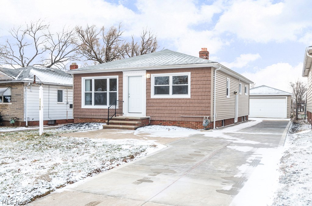 This home deserves a look TODAY! This 3/4 bedroom 1.5 bath ranch home has been completely renovated in 2014. You will enjoy the open feel of the remodeled kitchen with new counters, recessed lights, tile backsplash & laminate wood flooring. This open space overlooks the large living room with new carpeting & full dining room complete with built-in china cabinets. The main bath has been completely renovated featuring a new tub with tile flooring, tile surround, new vanity & fixtures. The lower level features a 36x12 rec room complete with bar. An additional lower level 4th bedroom next to large bath is perfect for a live-in relative, teen or office. Additional updates include: vinyl siding, new hot water tank, updated electric panel, all new vinyl windows, glass block windows, new entry doors, driveway, garage door opener. All appliances including high efficiency washer & dryer included. 4 acres of woods, city park & playground directly behind home. Call to set up showing!