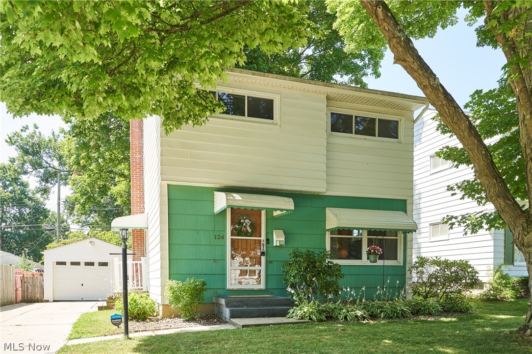 Welcome to this inviting 3-bedroom, 2-full-bath home in Cuyahoga Falls, offering a comfortable layout, warm character, and additional finished living space. The main level features a spacious living room with hardwood flooring and an open connection to the dining area, creating an easy flow for everyday living and entertaining. The dining room is accented by decorative wall trim and provides convenient access to the fenced- in backyard. The kitchen offers oak cabinetry, generous counter space, a tile backsplash, stainless appliances, a gas range, and a large window overlooking the yard. Upstairs, all three bedrooms feature hardwood flooring and ceiling fans, while the full bath includes a tub-and-shower combination, tiled walls, an updated vanity, and decorative accent tile. The finished lower level adds valuable flexibility with a carpeted recreation room, glass-block windows, a serving bar/pass-through area, a sliding barn-style door, and a second full bath with a walk-in shower. Outside, mature trees and established landscaping create a shaded, private-feeling setting with a patio area, storage shed, and plenty of room to relax or entertain. A long driveway leads to the detached oversized one-car garage. With its functional layout, charming details, and versatile lower-level space, this home offers plenty of room to settle in and make it your own.