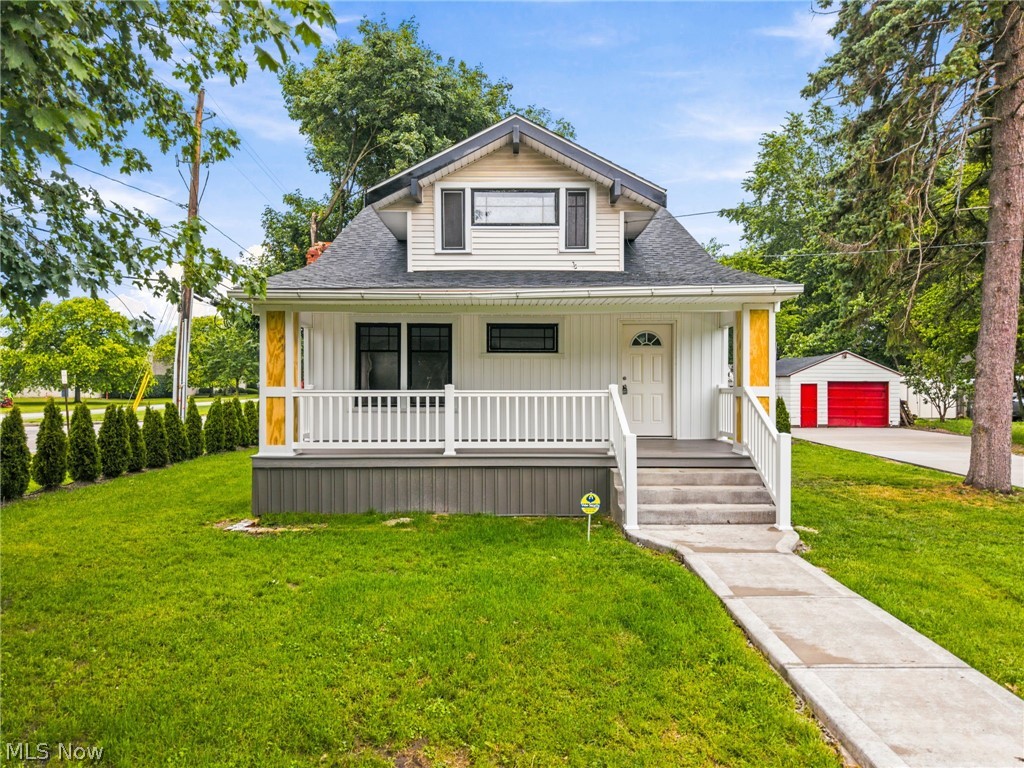 From the moment you pull up, the welcoming front porch sets the tone for what's waiting inside. Step through the door and you'll find a home that has been thoughtfully updated while preserving the charm that makes older homes so special. Original woodwork, beautiful trim details, and a classic fireplace create warmth and personality that simply can't be replicated in newer construction.

The main level offers a comfortable and functional layout with a spacious living room, dedicated dining room, updated kitchen, first-floor bedroom, and a beautifully renovated full bathroom. The kitchen blends style and practicality with white cabinetry, quartz countertops, stainless steel appliances, and modern finishes throughout.

Upstairs, you'll find two additional bedrooms, a second full bathroom, and the convenience of an upper-level laundry room. The oversized primary bedroom provides plenty of space to spread out, while the flexible layout offers room for family, guests, a home office, or hobbies.

Outside, the covered front porch feels like an extension of the home itself—a place for morning coffee, evening conversations, and everything in between. The backyard offers plenty of usable green space, while the detached garage and expanded parking area add everyday convenience.

Updates include: new trex front porch, new rear patio, new driveway, new siding, new roof, new furnace, and new hot water tank. 

With over 1,400 square feet, two full bathrooms, central air, extensive updates, and a layout that offers flexibility for a variety of lifestyles, this home delivers something many buyers are searching for but struggle to find: modern updates without sacrificing character. Move-in ready and full of charm, this is the kind of home that simply feels right the moment you walk through the door.
