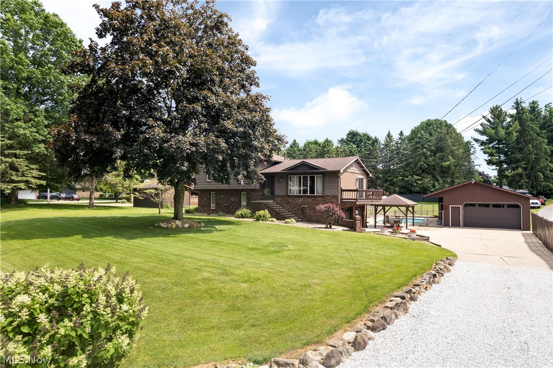 Welcome home to this meticulously maintained, 3-bedroom, 2-bathroom gem situated on just over half an acre in a quiet Green neighborhood featuring a private, single-entry design with one way in and one way out. From the moment you arrive, the property impresses with abundant room for parking, an attached 2-car heated garage, and an incredible bonus for hobbyists or mechanics: a massive 24-by-44-foot detached, heated garage equipped with a compressor that stays, plus an extra concrete pad tucked right behind it. Inside, the home offers a perfect blend of comfort and functionality, showcasing a spacious kitchen with gorgeous granite countertops and abundant cabinet space. Everyday chores are a breeze thanks to the large laundry area, complete with a washer and dryer that stay with the home. Natural light floods the inviting three-season room, offering a peaceful spot to unwind, while the bone-dry basement provides excellent peace of mind and storage—all backed by a whole-home generator for ultimate reliability.

Step outside into your own private oasis, designed as the ultimate outdoor entertaining area. The centerpiece is a stunning inground pool, recently upgraded with a brand-new pool heater to extend your swimming season, all surrounded by a large, flat, fully fenced backyard that offers endless space for recreation. Whether you are hosting a summer barbecue, relaxing under the beautiful gazebo, or enjoying the quiet surroundings, this backyard is built for making memories. Combining unparalleled workspace, premium updates, and an unbeatable outdoor lifestyle, 960 Karla Drive is truly a rare find.