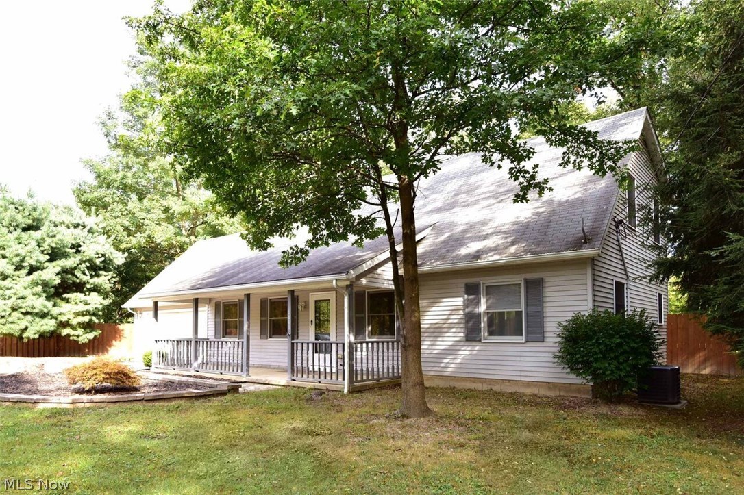 Beautifully maintained and decorated Colonial/Cape Cod home on a spectacular grassy and treed .7+ acre lot and yard!  Yard is perfect for kids play, pets and/or just a breathtaking view!  Home has a first floor Master Bedroom and 3 spacious second level bedrooms with large walk-in closets, ceiling fans and window treatments!  There are many newer updates including kitchen appliances, kitchen sink, carpet, central air, water heater and much more.  Bathrooms have also been updated. Home is sparkling clean and freshly painted.  Exterior features a privacy wood fence, stamped patio, hot tub and swing set!  Best Value for the money in Valley City!A first floor spacious in-law suite includes large bedroom, full bath and access to laundry room. A one year America's Preferred Home Warranty included with purchase!