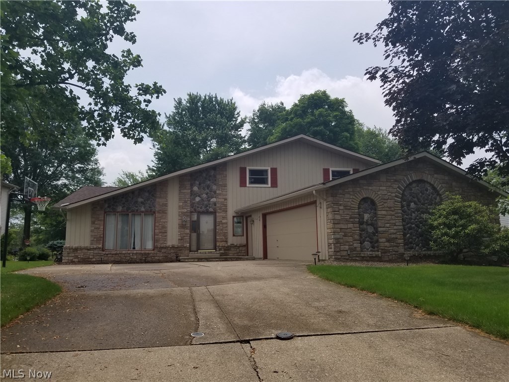 Welcome Home to 14731 Trenton Avenue in the Strongsville Chandler Commons Community.  Large Split level with 4 beds and 3 full baths.  The large kitchen features an eat in dining area, quartz countertops, island, oversized cabinets, two pantries and appliances including the new dishwasher. The kitchen is also overlooking the spacious great room with built in cabinetry, a bar area and wood burning fireplace.  Formal dining room opens to the large living room and both have cathedral ceilings.  The lower level has a full bathroom and bedroom.  The oversized 2.5 car garage provides entry to a very large laundry/mudroom with plenty of space and cabinets.  The large basement is currently a great space for storage or it could be finished.  The exterior features a large, landscaped yard with a patio and a parklike setting.  Chandler Commons is a wonderful community with walking trails, pool, sand volleyball, tennis, basketball playground, Pavilion and community activities.  Ask someone who liv