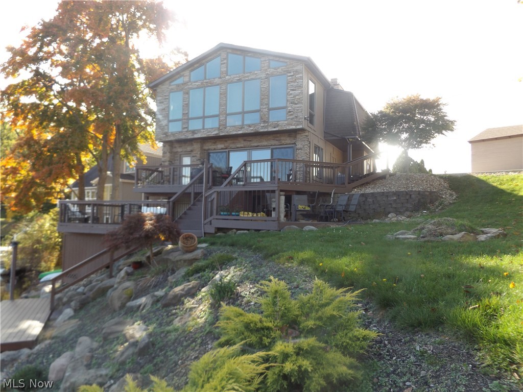 Situated on the main lake with a double Lot.  Private dock.  Take your boat for an evening cruise with dinner every night.  Enjoy the clubhouse menu and festivities.  Be part of a fun loving community with plenty of social activities.  Retreat into the privacy and serenity that nature has to offer.  Ths remodeled and ready to move into home offers three floors of ample living space.  Walk out lower level leads to the tiki bar, and a three tiered deck.  It has built in closet space, living and sleeping area, full bath, laundry, and storage.   The main level boosts lake views from most windows.  Upstairs master suite, two additional bedrooms, full bath with jacuzzi tub, office/living space, and beautiful loft.  Two fireplaces. 2 car attached garage and shed.  New cement driveway.  2017 Roof  2019 Furnace.  All upgrades are from 2012 and forward.  Make a lifetime of memories in this rare find at Willowdale​​‌​​​​‌​‌​​​‌‌​​​‌‌‌​​‌​​‌‌​​​​ Lake.