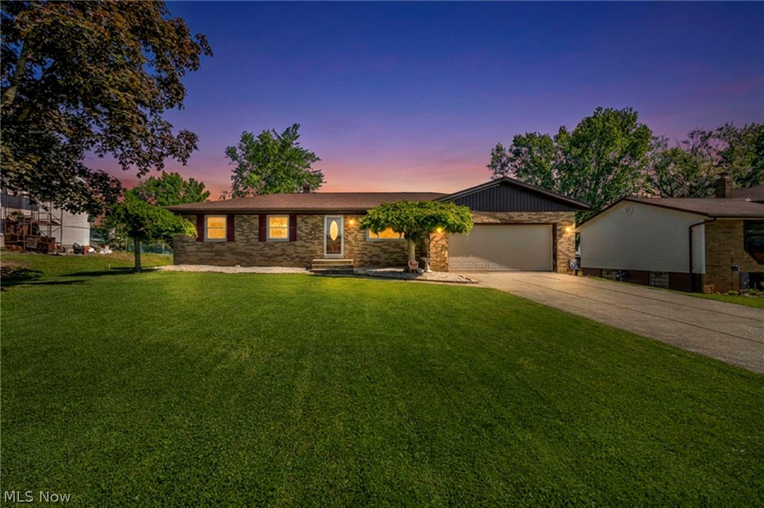 Welcome home to this immaculate 3 bedroom, 1.5 bath ranch tucked away in the heart of Brunswick!  Step inside and immediately feel the light, airy warmth of this beautifully updated home. Fresh paint, new flooring, warm neutral tones, and a light brick accent wall create an inviting first impression. The living room flows easily into the dining area, where sliding glass doors open to a concrete patio and a spacious fully fenced backyard, perfect for relaxing, entertaining, or everyday outdoor living.
The kitchen offers newer stainless steel appliances, including a Bosch dishwasher, along with solid cabinetry and plenty of counter space. Down the hall, you’ll find three generously sized bedrooms with refinished hardwood floors and a large full bathroom featuring a walk-in shower. The primary bedroom also includes its own attached half bath for added convenience.

The fully waterproofed basement is partially finished, providing additional flexible space for a rec room, home office, workout area, or storage. Major updates and improvements include roof and gutters in 2022, new exterior electric meter, new plumbing throughout the entire home and all the way to the street, replacement of all interior cast iron plumbing, new garage door, new windows, fresh paint, and new flooring throughout.

Move-in ready, thoughtfully updated, and full of comfortable living space inside and out — this one is ready to welcome its next owner.
