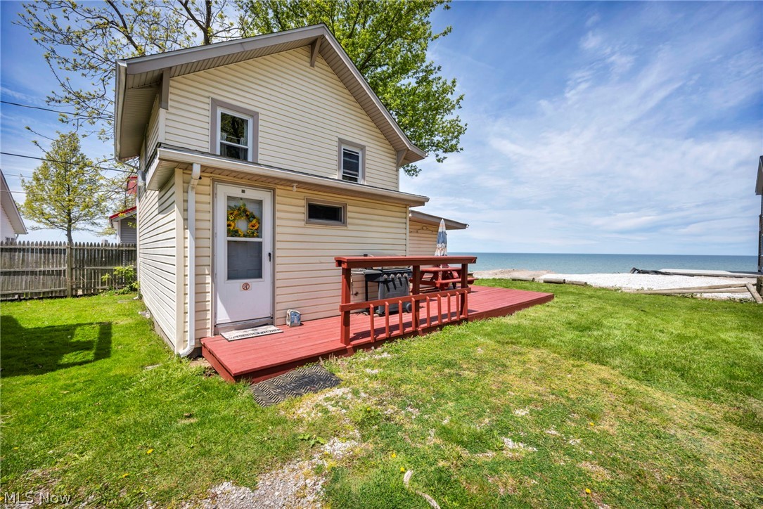 Rare opportunity to own a Lake Erie waterfront property with strong Airbnb, VRBO, and seasonal rental potential in the heart of Ohio wine country. Located just minutes from Geneva-on-the-Lake, Ashtabula Harbor, local marinas, restaurants, and numerous wineries, this property is ideal as a vacation home, seasonal retreat, or income-producing investment. Return figures are estimates based on market data and assumed operating performance with projected annual gross income of up to $50,552 and a modeled hybrid cap rate of 11.5%. The home features 3 bedrooms, 2 full baths, and a flexible bunk room, comfortably sleeping up to 6 guests and up to 8 in a pinch. Large windows highlight the lake views from the great room, primary bedroom, deck, and backyard. Refurbished cottage-style hardwood floors upstairs add a comfortable, homely feeling, while the layout is designed for easy lake living and entertaining. Enjoy a fully protected shoreline with direct waterfront access for swimming, kayaking, paddleboarding, and relaxing by the water. A road is currently being built directly to the shore for even easier lake access. The spacious lakefront patio provides plenty of room for outdoor seating, fire pits, and gatherings while enjoying sunsets and lake breezes. No HOA fees or rental restrictions offer maximum flexibility for short-term rentals and personal use. Offered furnished with appliances included, this move-in-ready property allows for immediate enjoyment or rental income potential. Parking for up to 3 vehicles. Direct Lake Erie waterfront properties priced under $500,000 are a rare find in today's market, making this an attractive opportunity for both investors and second-home buyers. Whether you're a local buyer, out-of-town investor, or seasonal “snow bird” owner, this Lake Erie property offers the waterfront lifestyle buyers continue to seek.