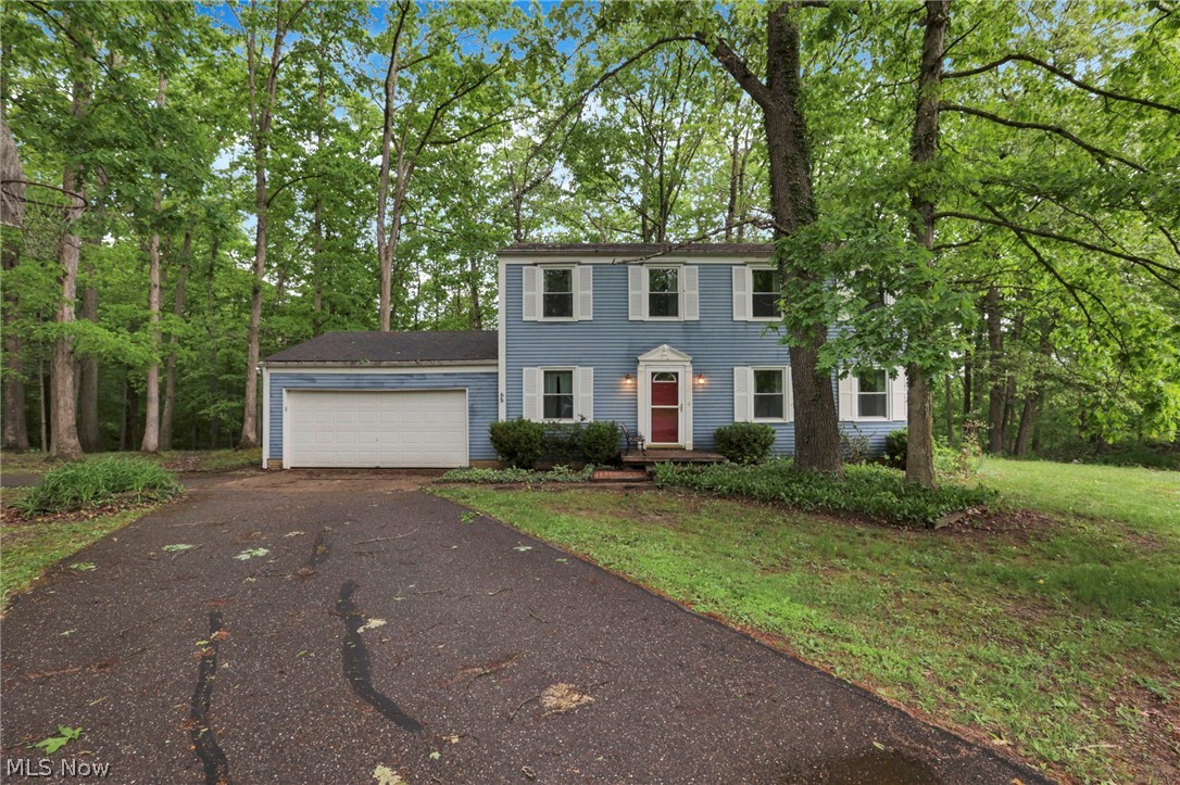 Nestled in a serene setting just 5 miles from Seneca Lake, this stunning 2-story residence offers the ultimate retreat on 2+ acres of wooded land. The flowing first floor plan seamlessly connects the Entry, Living Rm, Formal Dining Rm, & Kitchen. A convenient Half Bath is located off the Kitchen by the 2 Car Attached Garage. From the Kitchen, enjoy the Family Rm that is complete with a cozy fireplace & french doors that open to a spacious back deck and yard. The second level Owner's Suite is complete with a walk-in closet & attached Full Bath. Three additional Bedrooms & a second Full Bath are also located on the second floor. The lower level offers endless possibilities with a second family room, game room, utility room, and workshop. Schedule your showing today!