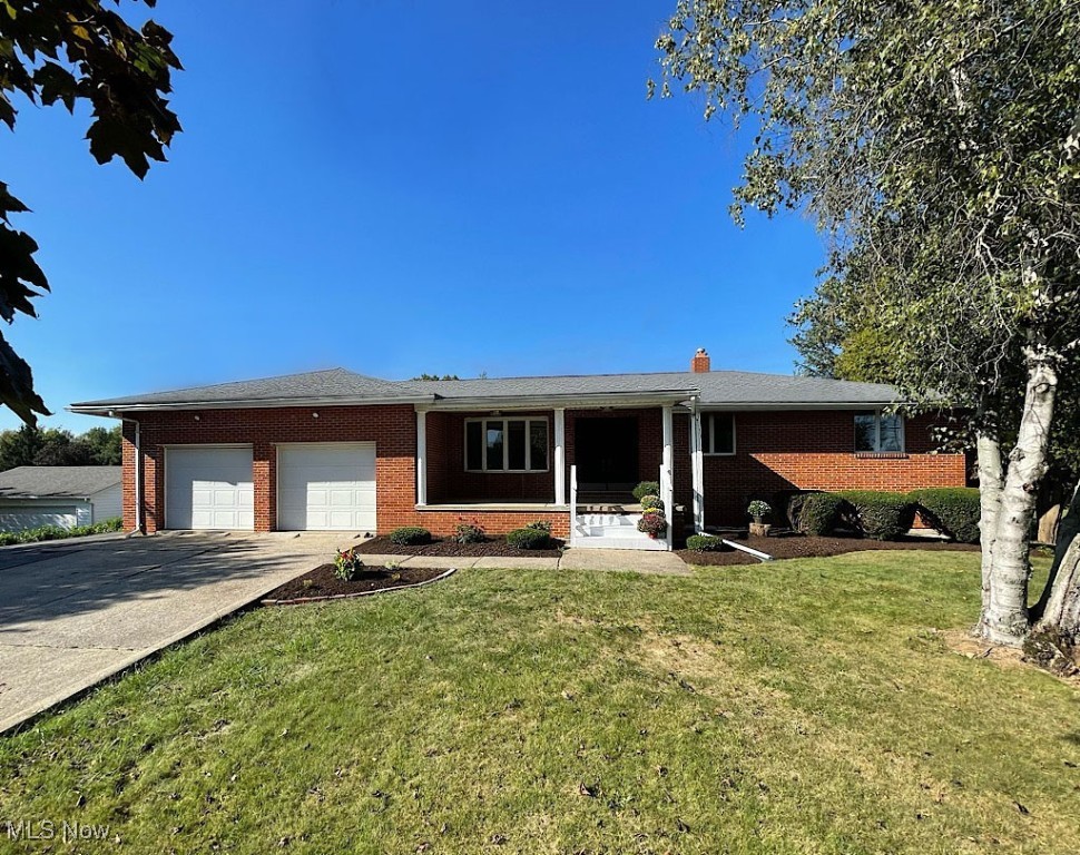 Remember the days of family gatherings when people brought their plates upstairs, downstairs, out to the deck, walked out to the yard, had great fun and just spent time together? This house will be perfect for that. Loaded with cherished memories and carefully-planned updates, this quality-built 5 bedroom, 'set back' ranch home has been in the same family for nearly 50 years. Conveniently located on 1.8 acres between Akron and North Canton, your first glimpse of the inside of the home is through a pretty double door entry, into a 19 ft. living room with bay window. The kitchen has an abundance of cabinet space, new countertops, flooring, and comes with all of the appliances. You'll love how it's open to a charming family room with fireplace, which will be just one of the fun centers of this home. The dining room will be great for intimate family dinners, and something you don't always find in a ranch home. A slider off of the family room leads to a 20 ft. long enclosed porch, and another slider  leads out to a fantastic two-tier, raised deck and ground-level patio. You will spend a lot of time here. Both overlook a spectacular rear yard space, which includes a huge outbuilding for extra cars or yard implements, and a 50x25 ft. garden that in its day, grew every vegetable imaginable. The big walkout basement has two bedrooms, another full bath with a shower, an office, and a 42' room with fireplace that can be beautifully-finished to be an extra family room, work out room or playroom. If you like to tinker in an attached garage, this one is oversized and it even has a wash bay for your pup! The driveway is super long and there's a wide driveway extender, too. Together, they will hold a load of vehicles. Plus, there's even a carport! Add in numerous updates to bathrooms, the kitchen, lighting, new paint and carpet, and a community and schools that value family, tradition and student success, and this one is a sure winner. You will not want to let it get away!
