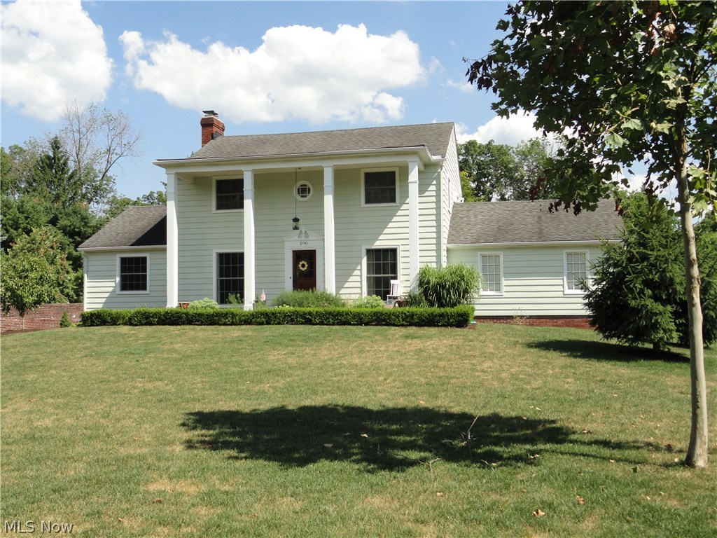 Charming classic Colonial in desirable Hudson location close to downtown! Situated on 1/2 acre and surrounded by the  historic Ellsworth Estate brick privacy wall. Foyer entry to formal dining room or formal living room with crown molding, oversized windows welcoming the sunlight plus a wood burning fireplace. Cozy first floor den or office with second wood burning fireplace and built in bookshelves. Plus a first floor sun room with a separate entrance adding an additional 225 sq ft of living to the first floor. Gorgeous refinished hardwood floors throughout the house. Snazzy vintage eat in kitchen is bright and cheery! Master suite with walk in closet and private bath. Two guest rooms with jack & jill bathroom. Newer windows throughout, newly insulated and a high efficiency furnace too. Easy side entrance driveway and rear entrance garage plus generous sized private backyard to enjoy. Lovingly maintained plus tasteful decor makes this home a gem!