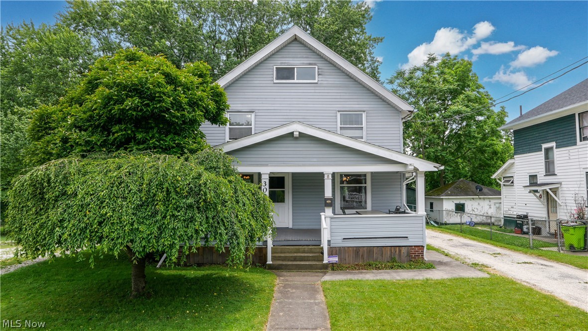 Step into timeless charm with this beautiful century home in the heart of Newton Falls! Filled with character and original hardwood floors throughout, this home offers the perfect blend of historic charm and modern convenience. The spacious kitchen is a cook's dream featuring granite countertops, abundant cabinetry, and a dedicated coffee bar. Enjoy relaxing evenings on the rear patio overlooking the fenced backyard, ideal for pets, play, or entertaining. The updated full bathroom features new luxury vinyl flooring, while the generously sized bedrooms provide comfort and flexibility for any lifestyle. A large walk-up attic offers incredible storage space or potential for future expansion. Conveniently located near downtown Newton Falls, parks, schools, and local amenities, this charming home is packed with character, space, and opportunity. Don't miss your chance to own a piece of Newton Falls history!