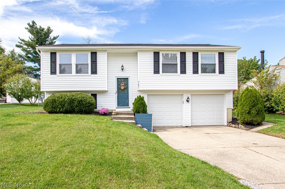Must see this beautiful Medina Bi-Level home.  Completely refreshed with new neutral paint and new flooring throughout.  A new patio door installed in Sept. 2022 off the kitchen to the walk-out deck in the backyard.  New Air Conditioning Unit installed in September 2022.  New built-in Microwave and newer dishwasher stay with the home also.  The home features a fireplace on the lower level and an attached walk-out garage for easy of access to the home.  Come see this charming family home today!