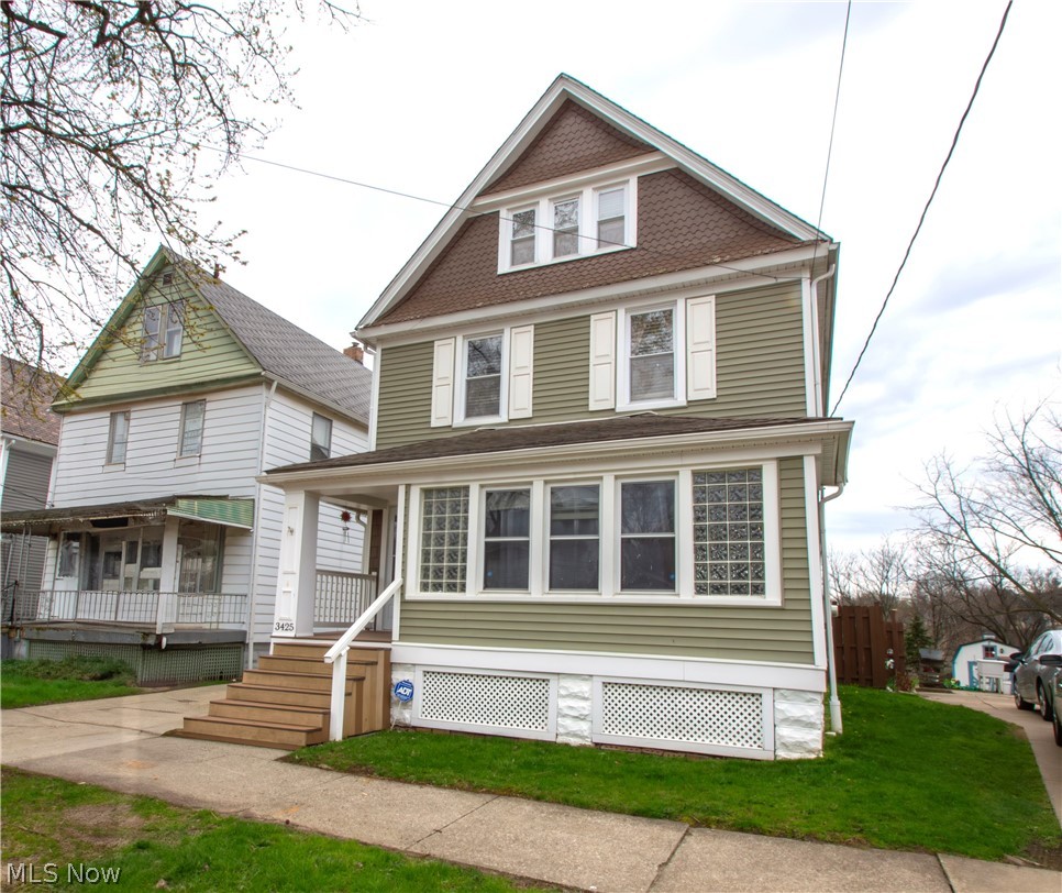 This truly one-of-a-kind home backs up to the Cleveland Metroparks Zoo, where you can relax on your elevated deck and literally hear the lions. Inside, you’ll find a beautifully updated kitchen with granite countertops, newer cabinets, and tiled backsplash, along with laminate flooring that flows through the kitchen and dining room. Old-world charm shines through original hardwood floors and built-in china cabinets, while the completely remodeled full bath features marble tile, slate flooring, and dual sinks. This home offers three bedrooms plus a fourth bedroom in the finished attic, along with a full waterproofed basement for extra storage and peace of mind. Outside is a backyard oasis on a 229'x36' lot with a concrete patio (2020), fire-pit area, and plenty of space for entertaining. Major updates include roofing, siding, high-efficiency furnace, water heater, central AC, garage, driveway—making this home the perfect blend of character, comfort, and modern convenience.