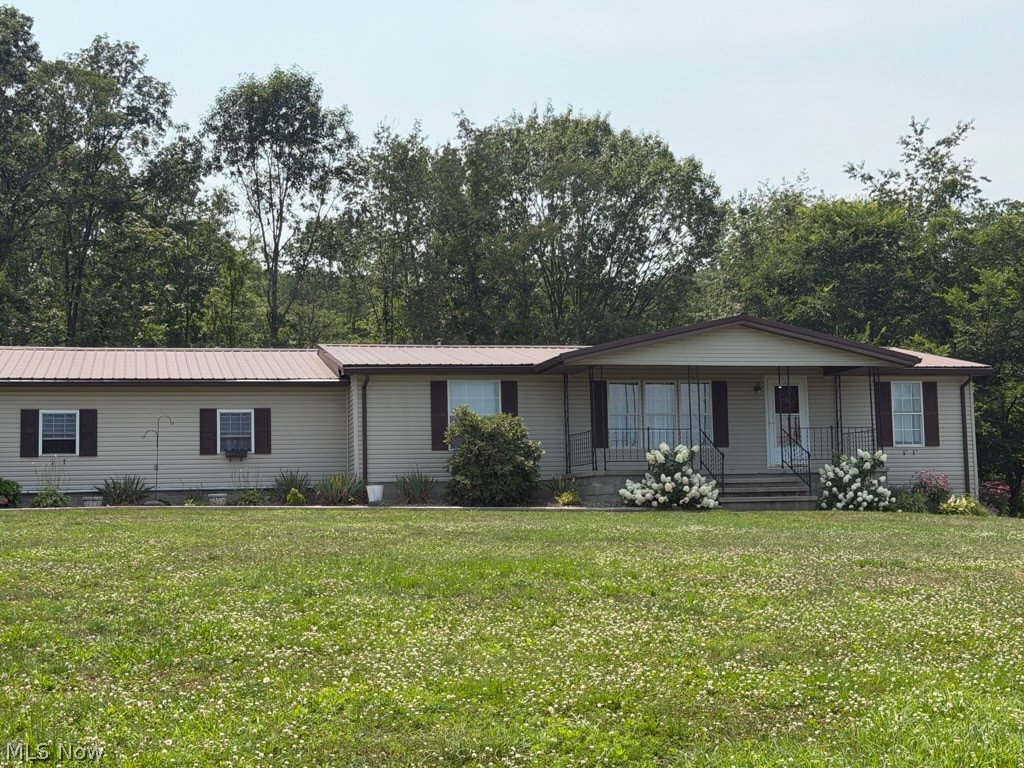 Beautifully maintained 3BR/2BA manufactured ranch on 11.54 private acres. Home offers approx. 2400 sq ft above grade plus 528 sq ft in partially finished walk-out basement. Spacious living areas, large kitchen with pantry, first-floor laundry, and flexible bonus/office space. Covered front porch and oversized rear deck overlook wooded acreage ideal for hunting, recreation, or ATV trails.

24x40 outbuilding (2022) with electric, insulation, and wood burner—excellent for workshop or hobby use. Additional storage shed on property. 2-car attached garage plus ample driveway parking. Well and septic. Heat pump with propane backup; central air.

Peaceful rural setting within Carrollton EVSD. Showings by appointment only—please allow notice. Do not drive property without confirmed showing.