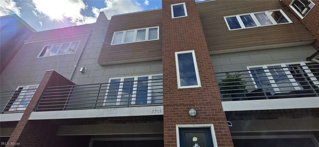 Tons of WOW in this Detroit Shoreway/Gordon Square neighborhood!  Attached garage goes up to the main living area and half bath, chef's kitchen with breckfast bar and balcony, go up another level and you have 2 spacious bedrooms with 2 full bathrooms.  There is a wonderful rooftop deck with views of Downtown Cleveland!  Don't miss out!