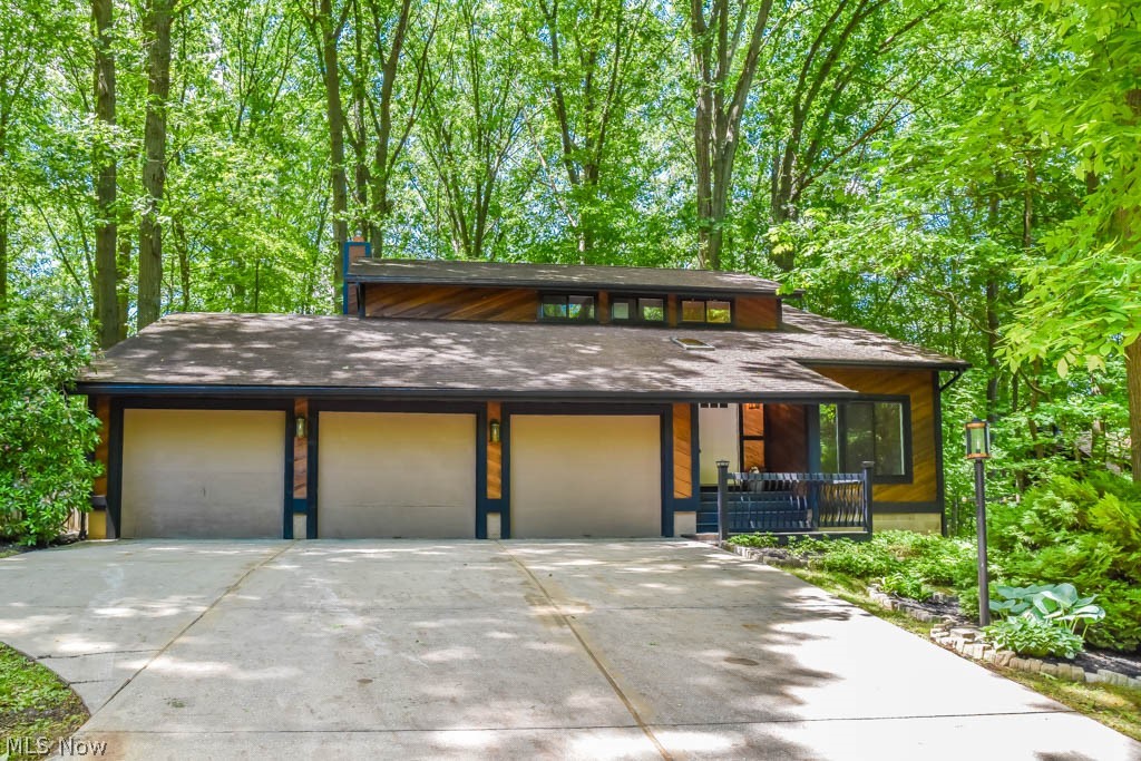 This stunning, modern rustic home offers the perfect combination of serenity and convenience! Completely remodeled 4 bedroom 2-story just waiting for your personal touches! New flooring, light fixtures, kitchen, bathrooms and fresh paint throughout. Step inside the impressive great room with cathedral ceilings, a skylights and large windows. Your inner chef will delight as you continue into the stunning kitchen with granite counters, stainless steel appliances, new white cabinets, subway tile backsplash and a center island with seating and shiplap accents. The kitchen opens to the family room boasting a brick fireplace set against a shiplap wall. Enjoy meals in the formal dining room with window seating. Updated half bath on the main level. Upstairs, the master suite offers a private balcony, a 12x6 walk-in closet and a private full bath with a floating dual sink vanity and separate toilet/shower room - convenient for getting ready in the morning! There are 2 additional bedrooms and a
