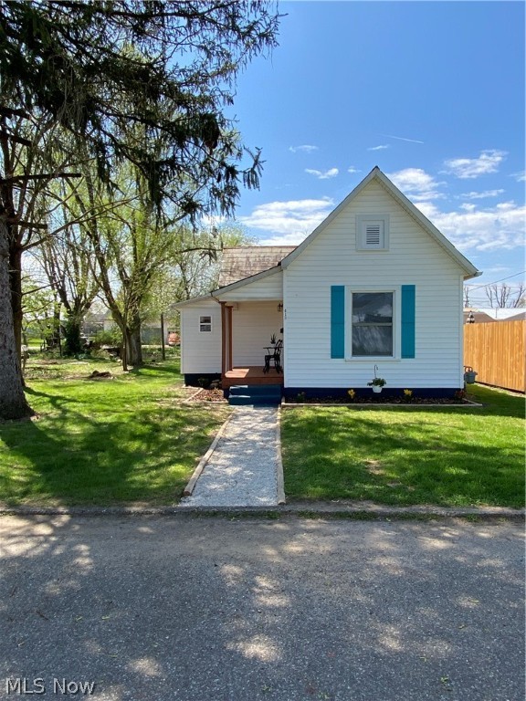 Affordable, adorable, completely gutted and remodeled home. This 1 bedroom, 1 bath home is so much bigger than the square footage shows because of the openness. Great starter home or for downsizing. All new kitchen (flooring, cupboards, counters, sink, island, lights) with a hint of color is open to the living room with new flooring. Bathroom was moved to make it larger.  A walk-in closet (complete with a vanity and rustic shelving) was added to the bedroom. New back deck that is assessable from bedroom, makes a great late night sitting area. Large laundry room was added off the bath. Updates include flooring, plumbing, electrical, all new windows, porch, deck and so much more. Large, flat back yard with a cement parking pad. New landscaping complete with flowers. Front and back door POPS with a splash of attention grabbing color. Roof does NOT leak but seller was planning to install a metal roof but ran out of time, therefore is giving a $3,000.00 roof allowance. Don't miss this gem!
