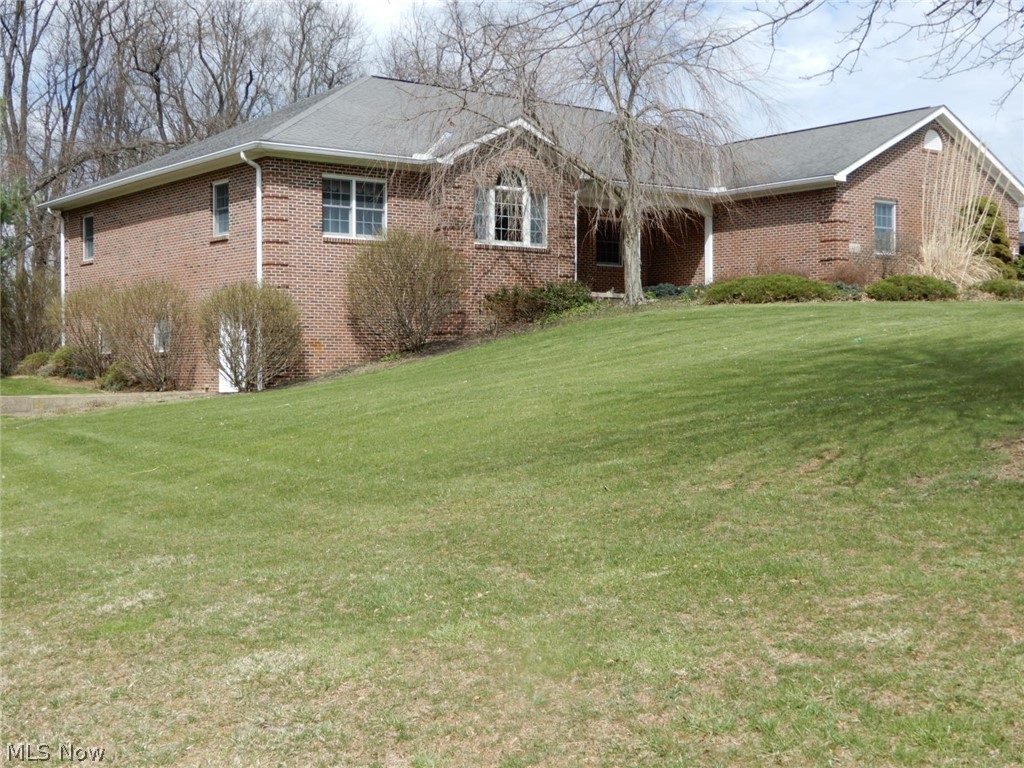 THIS IS A RARE FIND!! Beautiful custom built brick ranch style home with 4496 Sq Ft finished living space! Features huge great room with gorgeous gas log fireplace flanked by built-in cherry bookcases with surround sound that will convey, Cherry hardwood floors throughout, gourmet kitchen offers granite countertops, center island custom cherry cabinets, all appliances including a commercial Northland refrigerator, Very rare Aga natural gas stove with convection ovens from England, plus a Sub Zero refrigerator, huge walk-in pantry in the laundry room & built-in ironing board. Beautiful library with glass French doors & 2 walls of built-in cherry bookcases & desk. Primary bedroom suite bath features cherry vanity with granite countertop, corner jetted tub, walk-in ceramic tile jetted shower with rain shower head, huge walk-in closet and the large bedroom has a setting area, Built-in custom dressing area with makeup area & floater chest of drawers all in Cherrywood. The other 2 bedrooms have a jack & Jill bathroom with wingay wood vanities & cabinet on the wall, On the main floor there are 3 bedrooms with carpet flooring & 2 full baths with ceramic tile floor & 1 half bath with cherry hardwood floor. Nice 4 season sunroom with cherry corner TV stand, bookcase & cherry hardwood floor. Finished walkout lower level with 2nd kitchen with Hickory cabinets, stove, hood & refrigerator like new. Full bath with wormy chestnut vanity with granite countertop, Huge family room, 2 room that can be bedrooms or exercise rooms. All cherry trim, doors, cabinets, vanities , bookcases, all cherry hardwood flooring & anything wood in this house was custom built quality craftmanship by Bench Mark of Fredericktown. New multi zoned furnace in 2025 & new AC unit 5years ago, tankless hot water, whole house Generac Generator, central vac, Sun Setter Awning over the back deck, 3 car attached garage with gas heat & insulated doors. Interior pictures next week.