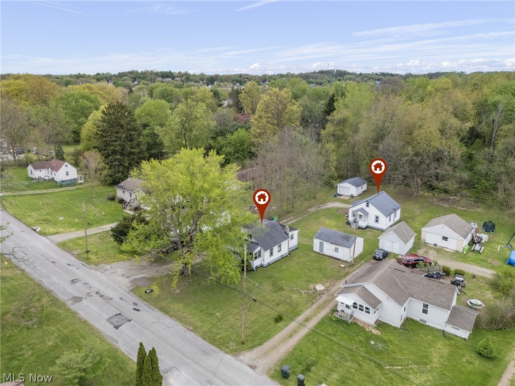 Talk about an amazing opportunity on this property! This little slice of Barberton heaven has 2 homes on one parcel.  The possibilities are limitless.  One home needs some TLC and the other home you can move into.  You can have multi generational families.  This would be a great income property for an investor.  The back home has newer roof and siding.  Each home also offers its very own garage.  Definitely need to come and take a look at these homes!