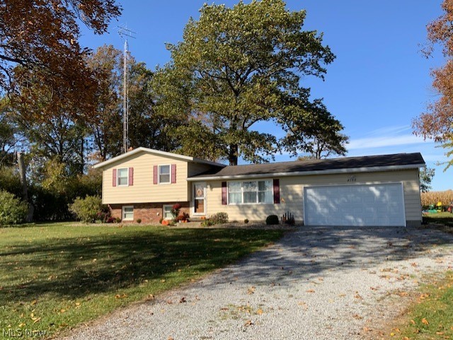 Interior pics will be provided soon. Waiting on drywall finishing to be done in a couple rooms. Great country setting with farmland views both behind the home and in front across the street. Green Local School District with a Wooster address. Many recent major upgrades that include roof shingles (2007), new windows (2009), High Efficiency Furnace - gas (2015), Family room completely remodeled (2016), Well pump (2021), Water Heater (2019), well pressure tank and new garage door on attached garage (2018). Large outbuilding measures 24x36 and is insulated and is heated with a dual fuel wood/waste oil burner, 220 volt electric service. All situated on an acre of land. This property will sell quickly so call your realtor right away to reserve your time. Offer deadline will be 5 pm Sunday, March 27th.