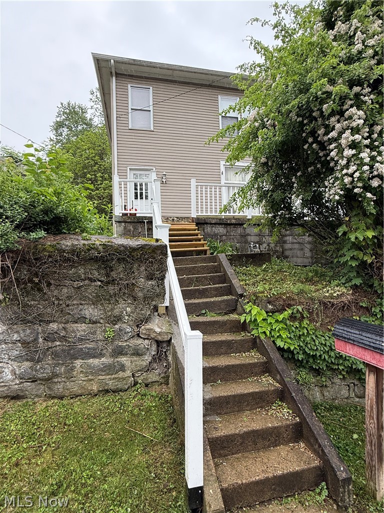This 2 bedroom 1.5 bath home sits on a double city lot and is ready for its new owner! The first floor offers a large living room,  dining room, kitchen, laundry and a 1/2 bath! Upstairs 2 large bedrooms with one offering a large walk in closet- the large bathroom also offers plenty of storage space! Step out back and enjoy your evenings on the back cement pad. New exterior vinyl railings were just installed on the front porch! This home has lots of potential and could be cheaper than rent! Call now to view it for yourself! *AGENT OWNED*