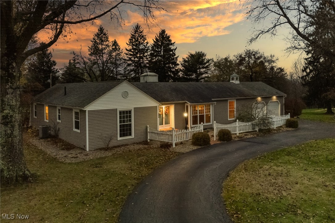 Relax and enjoy life in this beautiful home just outside Ashland!  A circular driveway and double doors lead into this 2000 sq.ft. ranch. There is a large living room with a bay window and electric fireplace, and dining room that overlooks the kitchen. On the other side of the home are 3 bedrooms, a guest bath and the primary suite with new walk-in shower.  Downstairs is a family room, laundry and extra storage.  Off the living room is the 3-season room opening to the brick patio with firepit and an inground pool with a vinyl privacy fence. There is also a 14x34 storage building and invisible fence. Too many updates to list!