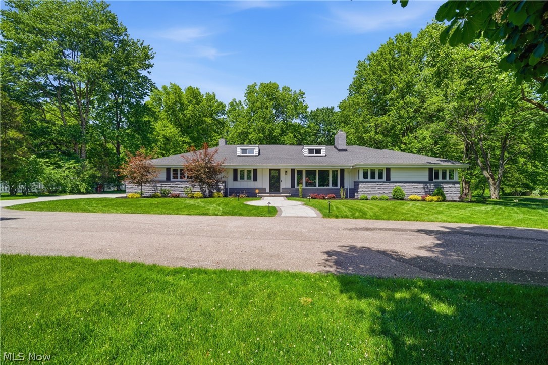 Stunning Cape Cod on 2.2 gorgeous acres in the sought after community of Gates Mills, Ohio.  Remodeled in 2023 and further updated and improved in 2023-2026, the floor plan offers options for different lifestyles.  The first floor has updated living, dining, family rooms, kitchen, utility room and powder room.  Also on the first floor are 3 bedrooms and 2 full baths which can be used traditionally,   but currently is used as a primary suite, 2 offices and his and her baths.  There is a bonus room up a private staircase currently used as a music room, but previously used as a playroom/bedroom.  Lower level is huge and has a separate apartment with living areas, wet bar that could become mini kitchen, bedroom and full bath, as well as a recreation room and much storage.  Even the garage has been updated!  Come see how this can fit your lifestyle!