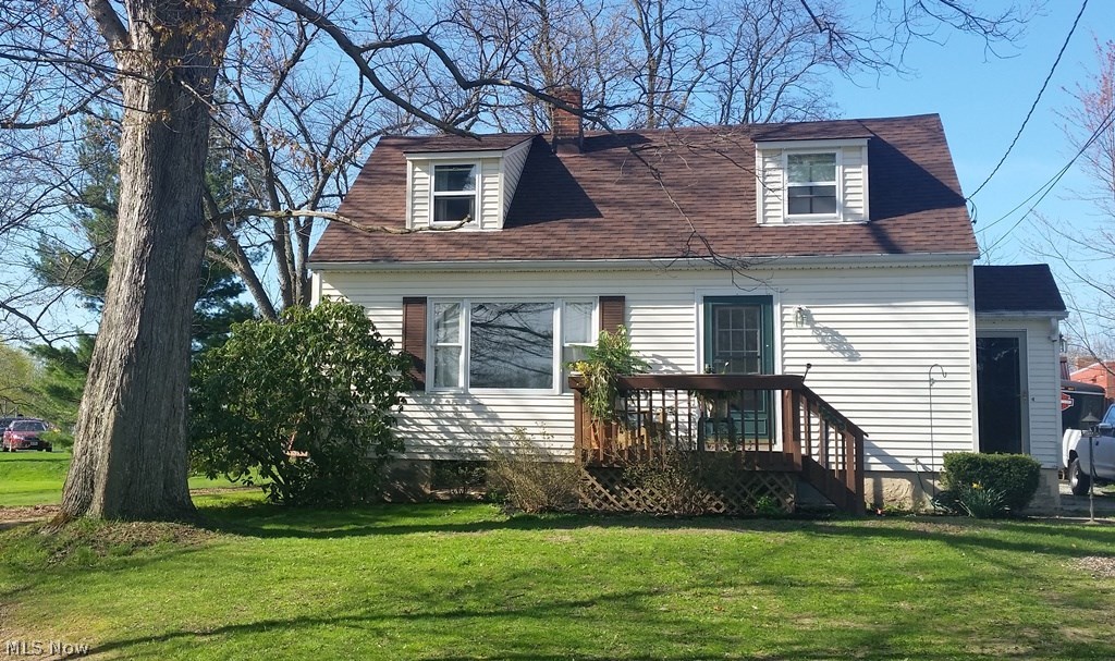 Burton Bungalow on Secondary Street. 1st floor offers eat-in kitchen, formal dining room, nice size living room, 1st floor bedroom, full bath and 2 additional bedrooms up (wall at back of stairs was removed for the 2nd bedroom ). Updates in 2012 include roof, hot water heater and gas furnace. Detached 2 car garge and beautiful 1/2 Acre lot.