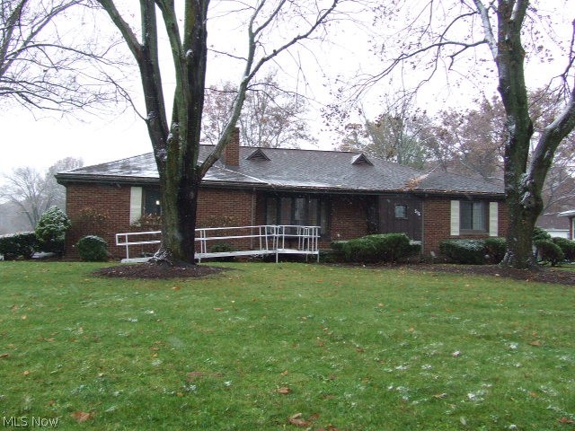 A beautiful setting for this all brick ranch in the West Akron area near Fairlawn Country Club. The foyer opens to a large open living and dining area highlighted with a lovely wood burning fireplace and huge bay window to show it off. The formal yet open dining room has a built-in corner hutch, and its own large bay window overlooking the backyard.  The large eat-in kitchen has its own backyard access, breakfast bar and loads of cabinet and counter space and a pantry!  All appliances stay, including the washer dryer. Master bedroom with bath and walk-in closet, another bedroom, main bath and a third bedroom that's being used as a den, but could be used as a third bedroom, complete the first floor.  The basement has a finished rec room, with fireplace, and loads of storage.  A separate workshop area and laundry area also.  A two car attached garage, nicely landscaped frontage, and large, flat back yard adds to the appeal of this home.  Just a little TLC would turn this into your perfec