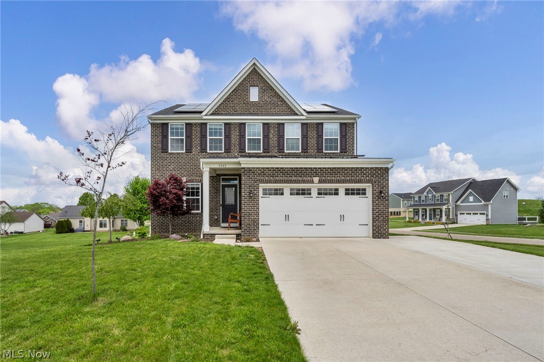 Spacious brick front Colonial located on over .41 of an acre property in the Saratoga Hills community in Plain Township, within the Plain Local School District, with a finished basement, stamped concrete patio, and access to many community amenities including a pool, clubhouse with fitness center, playground, and walking trails. The home features 4 bedrooms, 2.5 baths, and an open concept layout with over 3,315 living sq ft including the finished lower level with a large rec room and flex space that can be used as an office, exercise room, or additional bedroom if needed. An eat-in kitchen includes all stainless steel appliances, granite countertops, tile backsplash, and center island with seating, and is open to a family room with a gas fireplace and a dining area that overlooks the patio and backyard. A dedicated 1st-floor office adds flexibility for work, study, or quiet retreat. The primary suite features a large walk-in closet and en-suite bath with double vanity, soaking tub, and tiled Roman shower. A 2nd-floor laundry room, attached 2-car garage, driveway extension, and shed in the backyard provide added convenience. Additional features include a reverse osmosis water system, retractable ceiling fans in bedrooms and family room, and roof-mounted solar panel power generation. RECENT UPDATES completed in 2022-2024 include: Installed landscaping, whole house humidifier, water softener, water filter, reverse osmosis water system, stamped concrete patio, driveway extension, shed with concrete base, solar panels, finished bonus room in basement, installed 5 retractable ceiling fans, and custom window blinds. INCLUDED are ALL kitchen appliances and window blinds. Conveniently located near I-77, US-62, OH-43, schools, parks, shopping,  restaurants, and other local attractions.