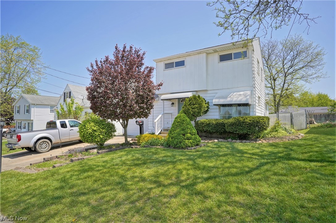 What a fantastic find in the heart of Cuyahoga Falls. This 3-bedroom, 2 full bathroom home has a spacious addition off the dining area that offers flexible living space (such as family room, home office, in-law suite, etc.) with its own private entrance full bath and 2nd laundry area. The other bedrooms and full bath is on the 2nd floor and features hardwood flooring witch can also be found under the receintly installed carpeting on the 1st floor.  Additional living space can be found in the finished lower level, which also includes a plumbed commode and privacy stall and a full shower.  Single-car, attached garage provides access to a bonus private screened-in back patio that can be enjoyed during warmer seasons. Fenced-in back yard helps keep this space very private and perect for pets and young children. Recent updates include painted interior in a neutral palette (April 2023) and vinyl replacement windows. Roof was replaced in 2013. Located near Newberry Park and just blocks away f