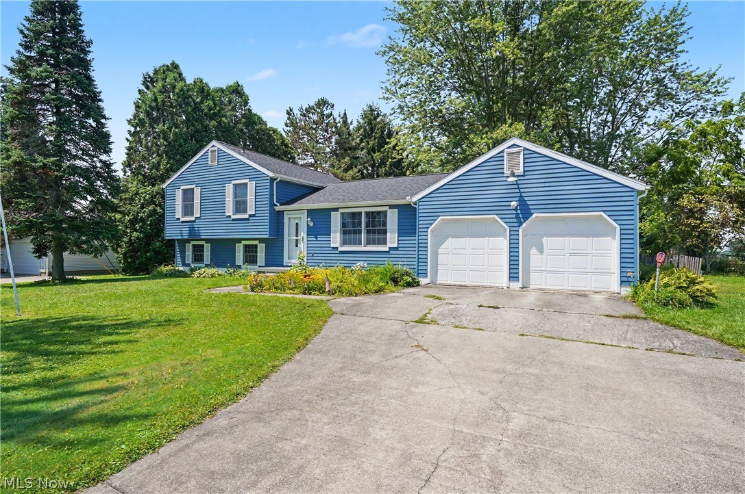 Split Level home located in Edinburg Township. Many updates including heat pump 2014, exterior house painting 2018, barn roof 2014, barn windows 2014, house Roof 2020, well pressure tank 2021 and water softener 2021, new patio door 2022, basement sump pump 2025, Leaf Filter Gutters 2022, new septic 2025, including electric, plumbing rework, and grinder pump installed. This is a very well maintained property. Three bedrooms, two full baths. Large covered rear deck. Two car attached garage plus two barns and a partially fenced in yard. Some nice trees in the back behind the barns.
