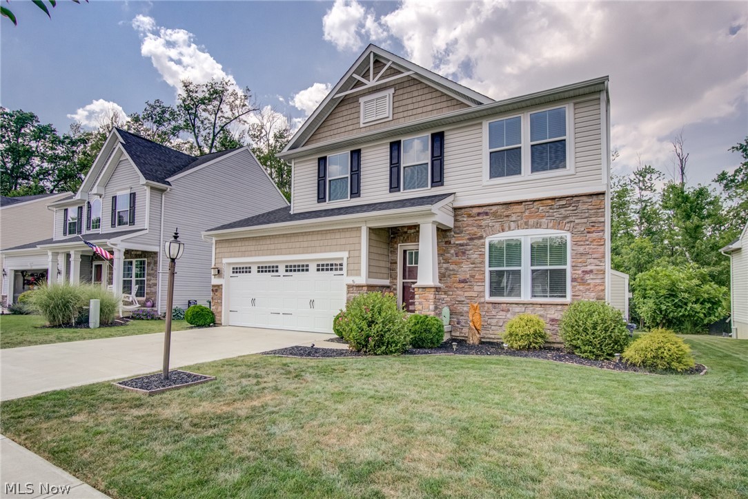 Five year young colonial in desirable Timber Ridge with a wooded view! Enjoy this open floor plan with first floor laundry and vaulted morning room. Impressive owner's suite with glamour bath, plus two additional bedrooms and loft on second level. Convenient location near highways. This home will impress you. Welcome home!