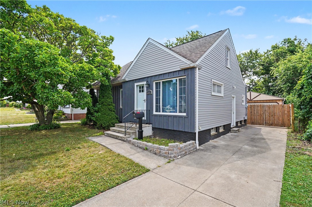 Welcome home to this beautifully updated 3-bedroom bungalow in the heart of Garfield Heights! This move-in-ready home offers nearly 1,400 square feet of comfortable living space with fresh updates throughout. The spacious living room is filled with natural light, while the updated kitchen features beautiful countertops and cabinets, stainless steel appliances, and modern finishes. Two bedrooms and a renovated full bath are conveniently located on the main level, with an oversized upstairs owner's suite that includes a separate sitting area—perfect for a home office, reading nook, or private retreat. The partially finished basement provides additional living or recreation space. Outside, enjoy a fully fenced backyard and a detached two-car garage. Conveniently located near shopping, dining, parks, schools, and major highways, this home offers both comfort and convenience. Don't miss your opportunity to make this charming property your own!