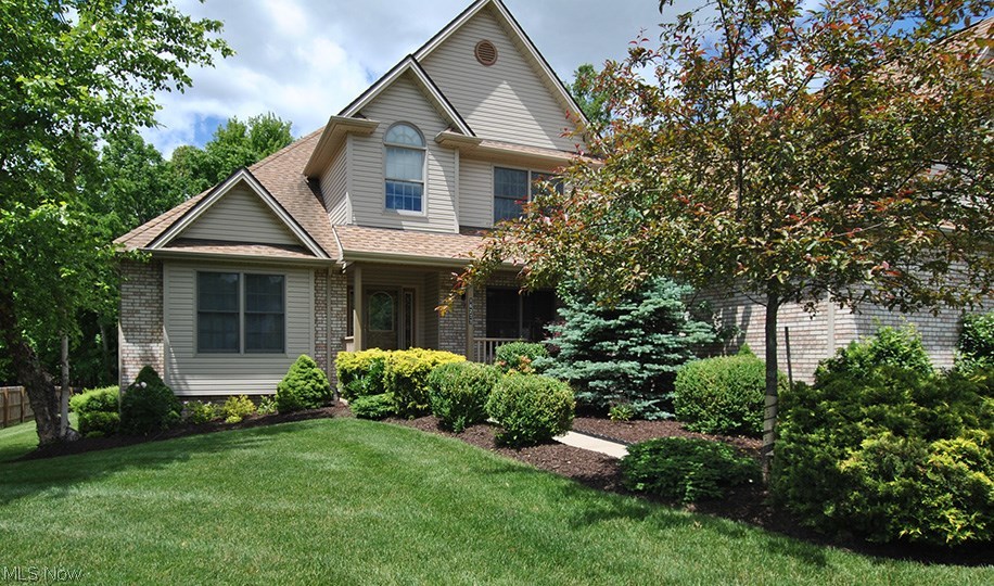 Stunning brick front, custom built home by Sherwood Homes w/front porch. One owner, true pride of ownership. May 2016 new stainless steel appliances in kitchen. Open floor plan, 2-story foyer w/custom staircase, wood floor. Spectacular 2-story great room w/custom fireplace. First floor office w/coffered ceiling and French doors, or could be living room. Formal dining room w/crown molding, wood floor. Fabulous kitchen w/custom cabinets, island, wood floor, all appliances remain. First floor master suite is beautiful w/coffered ceiling, 2 walk-in closets and glamour bathroom w/cathedral ceiling. First floor laundry room w/cabinets. 2nd Floor: 3 bedrooms, full bathroom, large walk-in attic area. Full basement w/roughed in bath. 3-car side load garage. Professionally landscaped, partially fenced area, custom deck. Private wooded peaceful setting. Prime location, walking distance to Metro Parks and golf course. Don't miss this fine home!