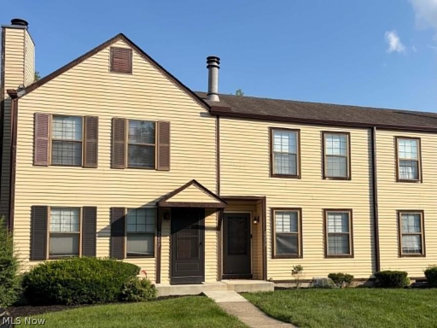 Welcome home to this maintained condo offering the perfect combination of comfort, convenience, and low-maintenance living. This inviting residence features an open stair layout with natural light, spacious living and separate dining area with the charming peek a boo window to the kitchen. The galley kitchen includes plenty of storage with a built-in pantry. The stove is heated by gas. Laminate flooring throughout. The convenience of having a half bath on the first floor and an open staircase. You will also have a private get away on the back patio off the kitchen door. The 2-bedrooms provide a peaceful setting with ample closet space and privacy on the second floor. The full bathroom features a tub and shower meeting your preferred need. This condo doesn't stop there! A recreation room in the lower level (basement) includes a decorative fireplace and plenty of room to create a day bedroom. The laundry space is located in the basement too. Having a storm ... enjoy the convenience of 2 dedicated parking spaces just outside your door! Plenty of community amenities that enhance your lifestyle. Ideally located close to shopping, restaurants, parks, entertainment, and major commuter routes, this condo offers easy access to everything you need. Whether you're a first-time buyer, or someone wanting to downsize, this property is an excellent choice. Seller is paying for a one-year home warranty plan as well. Patio furniture, washer, dryer, stove, and refrigerator convey with the home.  HOA covers anything outside the studs, exterior painting, maintenance, roof, siding.  This 2-story 1042 sq ft condo (in addition not included in the sq ft is a lower-level basement) the condo has 2 bedrooms, 1.5 baths, 2 reserved parking spots and so much more! Schedule your private showing today and discover all this wonderful condo has to offer as it won't last long!