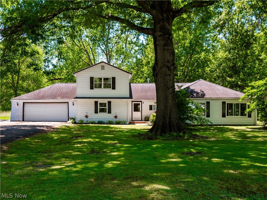 Don't miss this 4 Bedroom, 3.5 Bath Colonial on 5 acres in Columbia Station!  This property affords lots of space to accommodate for multi-use! Wide driveway and additional parking pad.   30'x40' Pole Building with dirt floor.  Property used to have horses and still can! Seller had gravel drive to the pole building. The focal point of the huge 30' wide Great Room Addition with vaulted ceilings and skylights is the grand wood-burning fireplace.  An enormous space to entertain & relax in, with views of the backyard. The Eat-in-Kitchen is open to the great room area, comes with all kitchen stainless steel appliances and has 7x5 walk-in-pantry, vaulted wood-paneled ceiling with fan and skylight! An area currently used as sitting room, could be a dining room, office, playroom or flex space!  A First floor huge master bedroom with additional room inside (currently a sewing room) would make a nice nursery, huge walk-in-closet or office area.  Private remodeled master bathroom has it's own tankless hot water tank, tiled floor and modern updates.   With two additional bedrooms on the main floor, owners are currently using one bedroom as a large mudroom and storage room. Upstairs a huge second Master Bedroom suite could become a shared bedroom or walled off to make two rooms, with it's unique design, having a full bath and double closets!  There is access to pull down attic with tons of storage as well!  A half bath just outside of main laundry room and utility room was perfect for guests at the back of the house while entertaining at the back yard patio.  Main Hot Water Tank (2018).  Sellers are offering buyer a one-year home warranty for peace of mind! Long-time owners enjoyed this great home and took pride in each addition!  Don't miss this one...a great piece of land tucked off the main roads, yet close to the center of town!