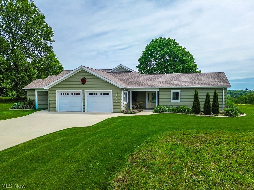 What an amazingly unique opportunity! There are so many ways to utilize this 2022-built ranch home. With farmland as the backdrop, you will love the country setting and the 1.12 acre homesite. The home was custom built with the future and energy efficiency in mind. Of course, you can easily use the 2,276 square feet as one home. Or, use the two separate living suites for in-laws, adult children, or anyone you want to keep close as the home is also ADA compliant. Short term rentals are very popular as an income producing option and this would be ideal. Now, let's talk about all of the money saving features that were thoughtfully added to the home. The home is solar panel ready, has extra attic insulation and extra thick insulated siding, the floors are heated in 3 different zones for ultimate comfort, mini-splits for heating and cooling, high efficiency windows, plus 2 air exchangers! The kitchen is fantastic and features Beko appliances and an induction stove. Not only do you have the patio off the kitchen area but also enjoy the front porch and an enclosed porch on the opposite side. It does not end there-extra amenities and upgrades include an EV hookup in the heated garage, tankless water heater, storm shelter, RO system, gutter guards, a greenhouse window in the garage, plus the home is plumbed for a generator and a dog wash. All of this plus it's located on one of the most picturesque streets in Orrville (Baughman Twp.) with beautiful views from any spot in the home. This is a special opportunity for the next owner to enjoy!