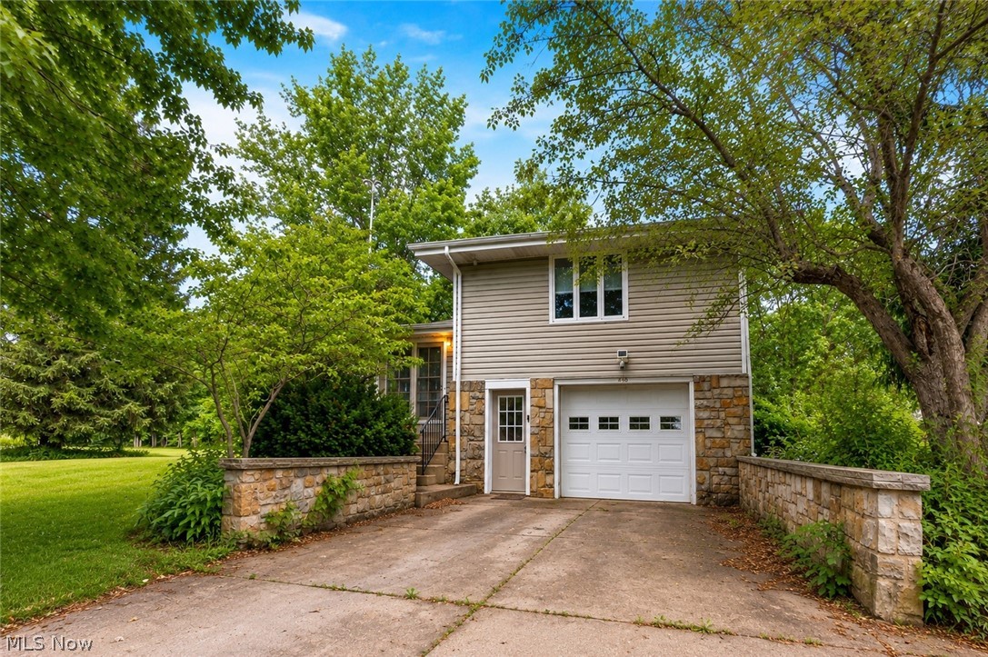 Nestled on 2.5 acres in Southington, 4146 Barclay Messerly Road offers the perfect blend of peaceful country living, functional space, and timeless charm. This 3 bedroom, 1.5 bathroom four level split provides room to spread out both inside and out, complete with an attached garage, a 40x60 pole barn, and beautiful outdoor spaces designed to be enjoyed year round. Inside, warm oak hardwood floors add character throughout much of the home. The spacious living room welcomes you with abundant natural light and flows effortlessly into the formal dining room, creating an inviting space for everyday living and entertaining. The kitchen offers ample cabinetry, generous counter space, and convenient access to the dining area. A laundry room adds everyday practicality, while the bright sunroom expands the living space and provides the perfect spot to relax while enjoying views of the surrounding property. The upper levels are home to three comfortable bedrooms and the full bathroom, offering privacy and convenience for family and guests alike. The finished lower level provides additional living space ideal for a recreation room, home office, fitness area, or media room, while the basement offers even more room for storage and future possibilities. One of the home's most unique features is the indoor and outdoor fireplace, allowing you to enjoy a cozy fire from both inside and out. Step onto the covered concrete patio and enjoy peaceful mornings or evenings overlooking the beautiful backyard. 3 raised flower beds add charm to the landscape, while the expansive 40x60 pole barn with a newer metal roof, insulated doors, and 60 amp service offers incredible flexibility for hobbies, equipment storage, workshop space, or recreational vehicles. With central air, a gas furnace, newer electrical service, poured concrete walls, and two and a half acres of beautiful property to explore, this is a rare opportunity to enjoy space, privacy, and country living without sacrificing comfort.