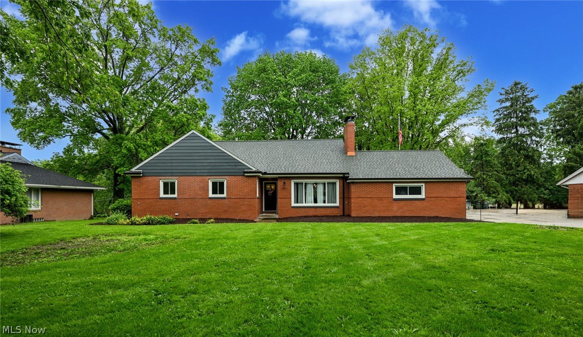 Step into the perfect blend of modern updates and timeless elegance in this Avondale home. This brick beauty is designed for making memories, offering 4 generously sized bedrooms and over 3700 sq ft of living space. Car enthusiasts and hobbyists will fall in love with the 4 car garage. Kitchen is beautifully updated with new cabinetry, butcher block counters, and LG appliances. Open living room/dining room combination with fireplace. Cozy sunroom overlooks the rear patio and sprawling back yard. Expansive first floor family room with vaulted ceilings, fireplace, built-in shelving, wet bar, and convenient half bath. This room is perfect for entertaining and is just steps away from the rear entry and unique indoor grill. Handy first floor laundry room. First floor master bedroom with double closets and master bath. Additional bedroom, full bath, and office/study on the first floor. 2 huge bedrooms on the second floor. Partially finished lower level with bar, half bath, and additional shower. Many updates including windows, gutters, plumbing, electrical, lighting, flooring, carpet, paint, doors, + more! A spectacular home in a convenient location.