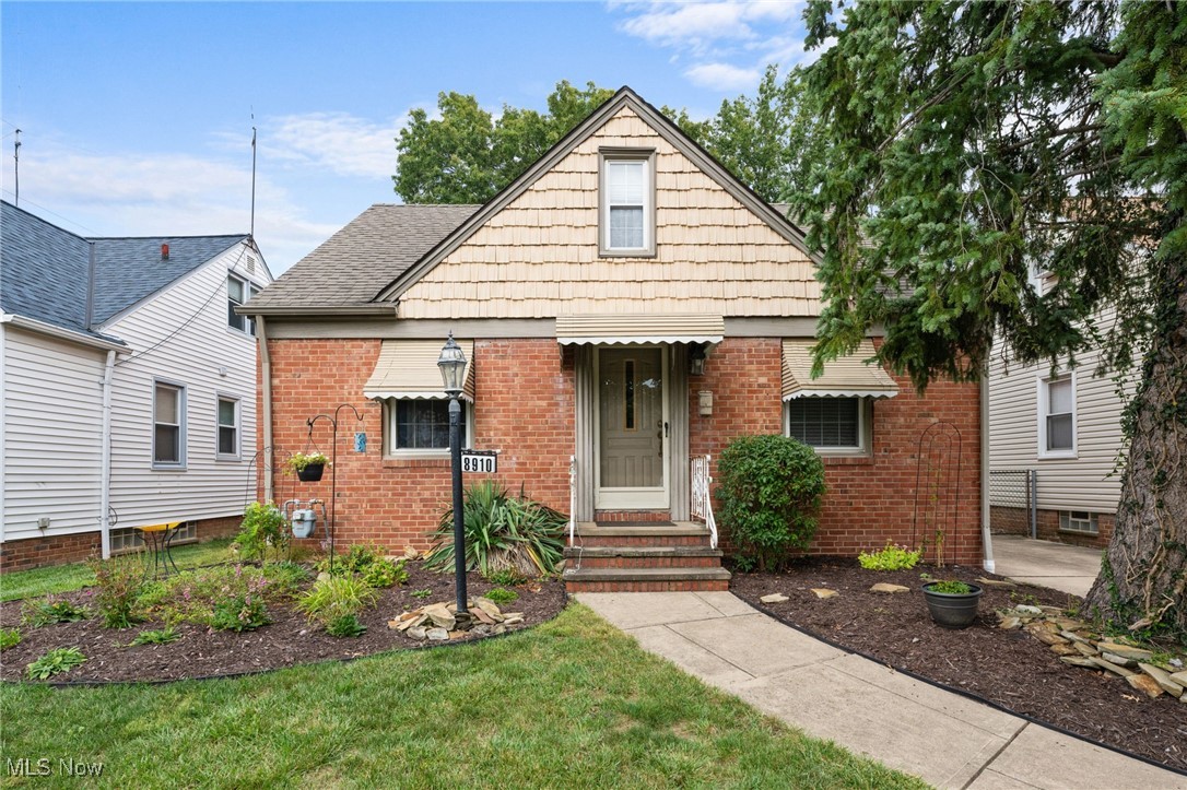 Charming cape cod in desirable neighborhood with loads of curb appeal.  First floor features cozy living room and 2 bedrooms with hardwood flooring, a full bathroom with fresh paint, an eat in kitchen with new dish washer.  Huge bedroom on second floor with tons of storage space.  Partially finished basement has new luxury vinyl flooring, bar and gas fireplace perfect for entertaining.  Large full bathroom in lower level adjacent to unfinished portion and laundry.  Detached 2 car garage.  Central AC compressor replaced in 2023, neutral paint colors, move in ready!  Close to highways, Downtown Cleveland, Shopping, Restaurants.