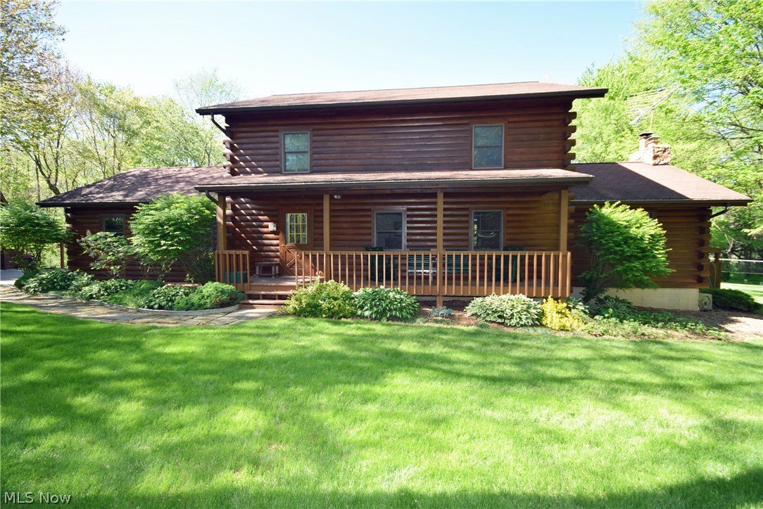 Charming log cabin style house on over 3 acres. 3 bedrooms, 2 full baths and 2 1/2 baths! Family room boasts vaulted ceilings with exposed beams, a wood burning fireplace and a sliding glass door that open to the deck.  The large patio and in-ground pool make this space great for entertaining.  Mater bedroom complete with a master bath and private deck overlooking the pool and backyard.  Finished room in walkout basement with a wood burning stove.  Private yard. 2 car attached and 2 car detached garage with workroom plus a lean-to.  Updates: House, shop, deck, porch and fence stained in 2016, Water softener - 3 yrs old