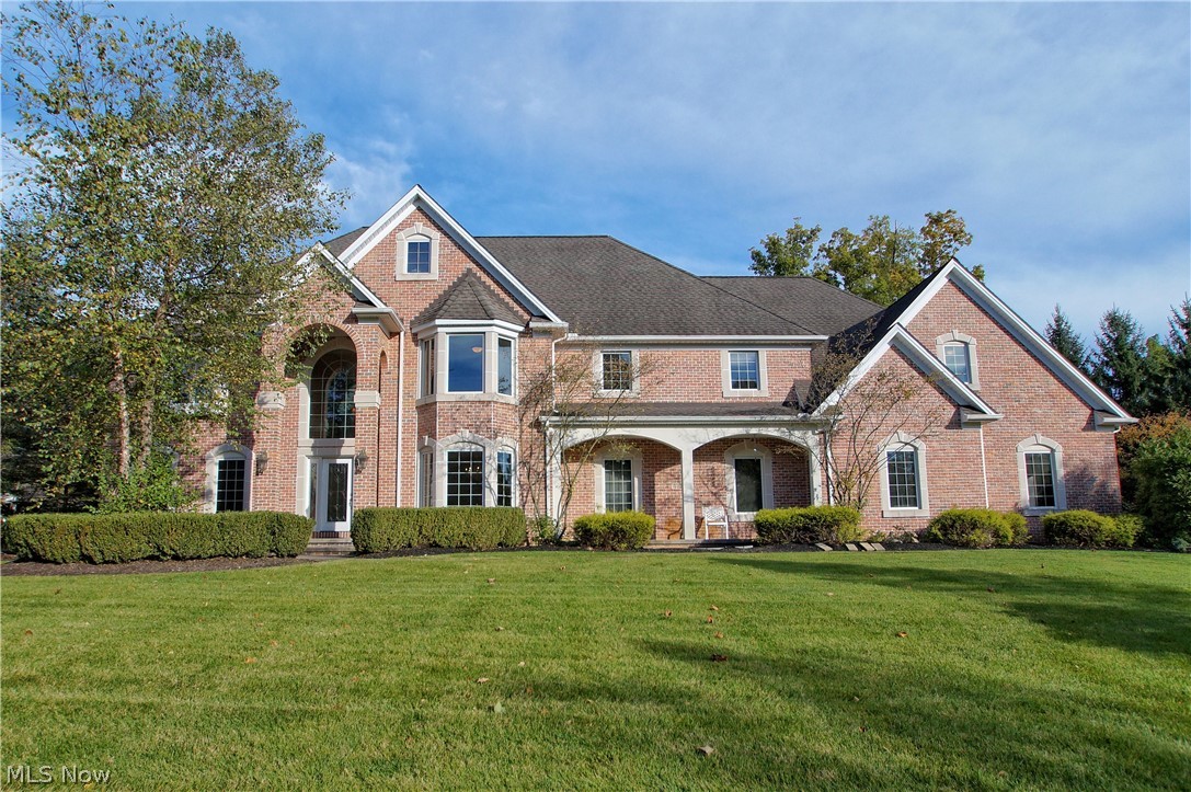 WOW! Over 8000SF of living space in that absolutely stunning 4/5 bedroom, 6 bath ALL BRICK Colonial located in the pristine Kirtland Lakes subdivision. Overlooking a pond, this home is as beautiful outside as it is inside! Are you a fan of entertaining? Do you want space that flows from an amazing indoor space to a awesome outdoor space? Does form meets function appeal to you? If so, then this home needs to be your next home! Maybe you need 2 offices? This has that. Maybe you need a really cool master bedroom design with private entrance from the garage, double master walk in closets, enormous bathroom, separate sitting room or nursery + walk up attic for storage? This has that too! Want the ultimate man-cave, teen hangout basement? Then this is perfect for you! When we say this home has everything, it really has everything! Wide open kitchen design, great room with 20' tall ceilings More storage than you can ever imagine! 4 car garage! built in hot tub on the brick patio. The list is