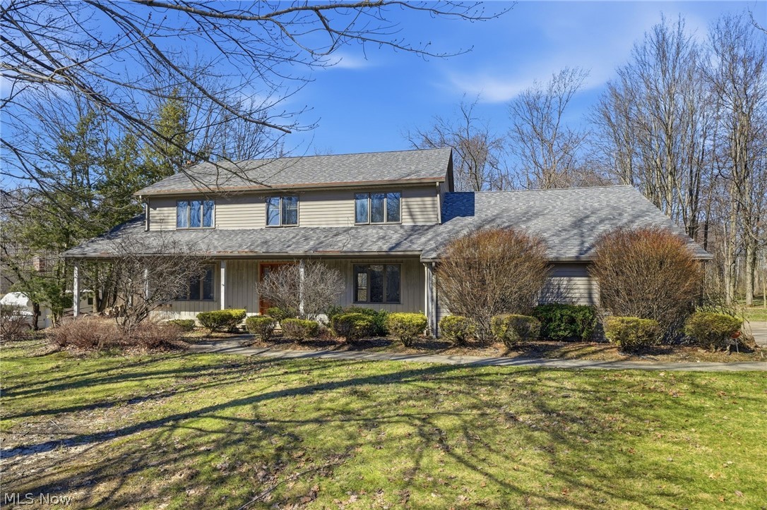 Welcome to 19649 Sagamore Rd in Walton Hills, an exceptional opportunity to own a spacious 5-bedroom colonial on nearly 1 acre with a peaceful, park-like setting, a covered wraparound front porch, and endless potential to make it your own. Priced at $399,900, this move-in ready home offers over 2,800 square feet above grade plus approximately 1,242 finished square feet in the lower level, delivering an incredible amount of living space for the price.

Inside, the home features generously sized rooms throughout, giving everyone space to spread out and enjoy. The main level offers rare first-floor living flexibility with a first-floor bedroom and full bath, ideal for guests, multigenerational living, or a home office. Entertain with ease in the formal dining room with coffered ceiling, and enjoy seamless flow between the living room and family room through elegant French doors. The family room is warm and inviting with a fireplace and partially vaulted ceiling, while the updated kitchen features quartz countertops, stainless steel appliances, white cabinetry, and recessed lighting.

Upstairs, the vaulted owner’s suite offers a spacious retreat with a walk-in closet and private bath featuring dual vanities, a skylight, and a relaxing garden tub. The finished lower level adds even more versatility with a large recreation room, half bath, additional kitchen area, and abundant storage space.

Outside, the semi-private backyard feels like your own retreat with partial woods, room to play, and a patio perfect for outdoor entertaining. Located near Metroparks and shopping, this home combines nature, convenience, and value. With solid space, timeless charm, and room for future updates, this is a rare chance to build equity in a desirable setting.