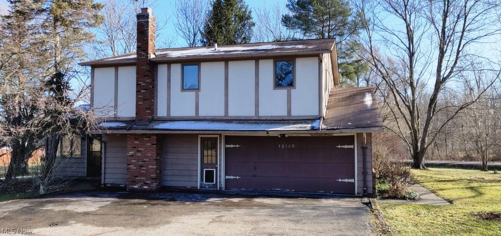 Tons of space and potential in this 4 bedroom home, formal living area and family room with fireplace, full basement with shelving and more.