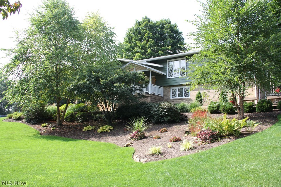 Pride of ownership apparent in this MINT condition home! Perfectly situated in a quiet cul-de-sac on almost half an acre of lush landscaping and manicured lawn, this home has been updated throughout and shows like a dream with updated: remodeled kitchen w/maple cabinets/granite counters/top of the line stainless steel appliances, alcove w/bench &storage/open dining area, roof ’12/ bathrooms remodeled/water heater ‘08/ garage doors/ carpet/paintwork/Septic and leach beds 97’/ well and pump ‘98/rebuilt deck & painted ’12 /added two floor addition- 1st floor family room and walk out lower level bedroom in ’85 and more! Beautifully landscaped and close to ALL amenities.