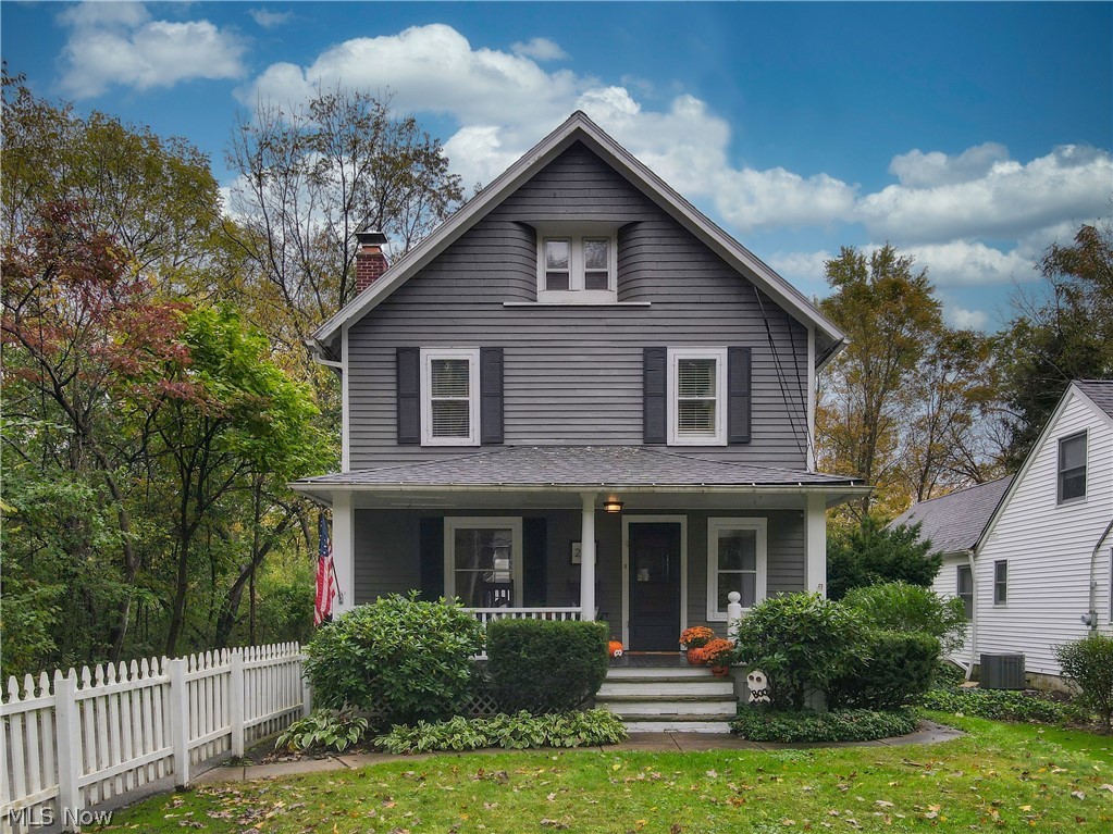 Charming century home complete with white picket fence and cozy front porch! Here you'll find the charm of yesteryear and today's modern conveniences. The foyer boasts restored oak woodwork including the banister and front door. The new hickory hardwood floors are found throughout the first floor while the upstairs has pine hardwood under the new carpet.  The oak woodwork continues into the living room where you'll also find a beautifully updated gas fireplace. The dining room is just off of the living room and even has a charming window seat. The newly renovated kitchen has new cabinets, quartz countertops, stainless appliances as well as new recessed lighting. There is a gas range for the chef of the house as well as a built in wine fridge under the breakfast bar. The updated walk in pantry finishes off the kitchen.  Upstairs you'll find two bedrooms as well as an extra room that is perfect as an office or additional bedroom. The newly renovated bath has a double vanity and is large