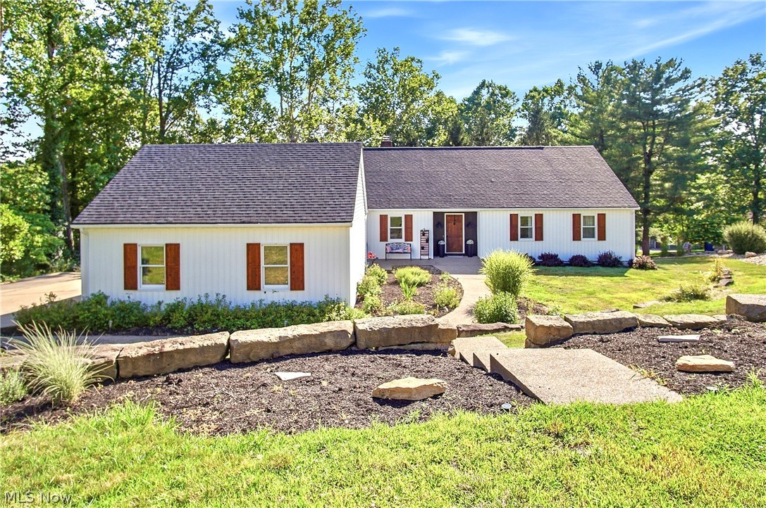 Welcome to the desirable Stonehenge Subdivision in the Tri-Valley Local School District! This spacious 4-bedroom, 3.5-bath home offers an abundance of finished living space, providing plenty of room for everyday living, entertaining, and accommodating guests. The main level features 3 bedrooms, while the mostly finished walkout lower level includes an additional bedroom, a large family room with a wet bar, a bonus room, and ample storage and workspace. The updated kitchen showcases granite countertops, updated cabinetry, flooring, and lighting, with beautiful hardwood flooring throughout much of the home and a formal dining room for entertaining. Enjoy the convenience of first-floor laundry, public water and sewer, and a 2-car attached garage. Step outside to a large multi-tier composite deck with vinyl railing overlooking a partially fenced backyard, perfect for relaxing or hosting family and friends. Major updates include a newer roof and siding (2023), HVAC (approximately 2-3 years old), and hot water tank (approximately 1-2 years old). Situated on approximately 0.85 acres with a concrete driveway, this move in ready home offers the space, updates, and location you've been searching for! Don't miss your opportunity to call Stonehenge home!