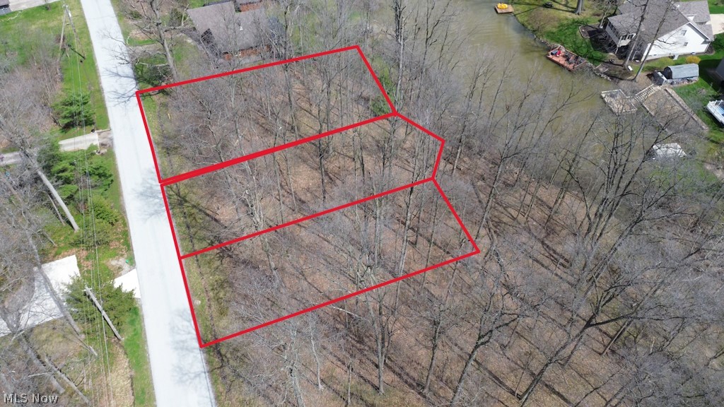 Tucked inside the gated community of Cinnamon Lake, this wooded lot offers the perfect opportunity to create your own private escape or future home.
Surrounded by nature and just moments from the water, this property gives you the freedom to build at your own pace while enjoying everything this incredible community has to offer. Whether you’re dreaming of a weekend getaway or a full-time residence, this lot delivers the setting to bring your vision to life.
Cinnamon Lake spans over 1,200 acres and features a stocked lake for fishing and boating, a sandy beach, swimming pool, clubhouse, restaurant, and year-round activities. With utilities available and a peaceful, wooded backdrop, this is more than just land — it’s your chance to invest in a lifestyle.
If you’ve been waiting for the right place to build, unwind, and enjoy lake living… this is it.
**Lot Lines in aerial photos are intended for general reference and are not precise boundaries.**