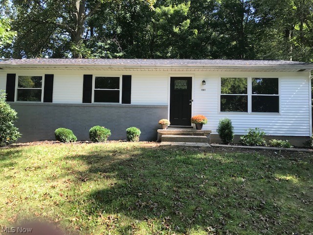 BACK ON Market!  This is the home you want if you want a place that was completely remodeled in 2018!  Pack your bags and get here quickly! Across the street from a nice fishing lake in Stow, this beauty has been brought back to nearly new status with today's gray and neutral color palette!  New roof, new siding, new windows, new doors, new kitchen (with luxury vinyl laminate flooring)with new fridge and disposal, new bathroom (with marble vanity and tile surround), new floors, new light fixtures, new deck, and so much more!  Situated on a large lot, with almost a half acre of trees, this is the perfect lot for someone who wants a large yard for pets or privacy, yet not a lot of grass to mow and maintain!  The basement is a large awesome space that would be a wonderful footprint for additional finished rooms!   Surrounded by higher priced homes, this beauty was priced perfectly for someone who wants to "buy right"!!!  Come see it today!