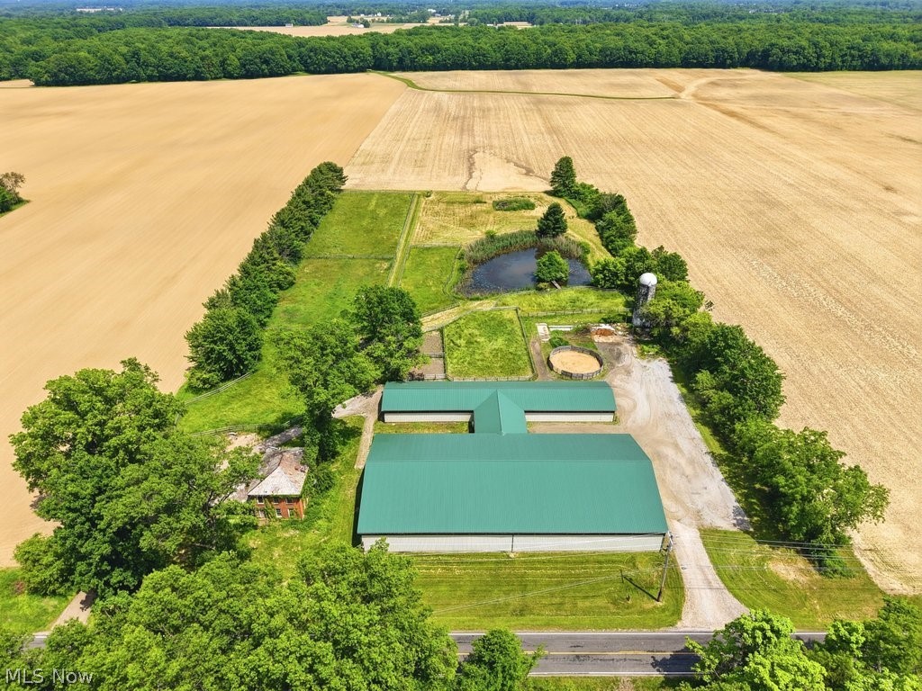 Welcome to this turn-key barn in Litchfield Township! Situated on 5.81 acres, this impressive facility features a 78' x 150' indoor arena and a well-equipped barn with 22- 10' x 10' stalls, one 8' x 10' stall, and one 12' x 10' stall in the main barn. Additionally, there are four temporary 10' x 10' stalls, one 10' x 11' stall, and an 11' x 11' temporary stalls located in the arena.

The barn offers a hot/cold wash rack, concrete floors, matted stalls, and 26 tack lockers equipped with bridle and saddle racks. A dedicated viewing room provides a comfortable space for lesson programs for spectators to watch activities in the indoor arena.

Outdoors, you'll find two 34' x 32' all-weather paddocks, a round-pen arena, and five pastures, including one that is prepped for the construction of an outdoor arena.

This property is full of potential! Use the barn for car or boat storage, continue operating it as an equestrian facility, or explore countless other possibilities. Bring your vision to life!